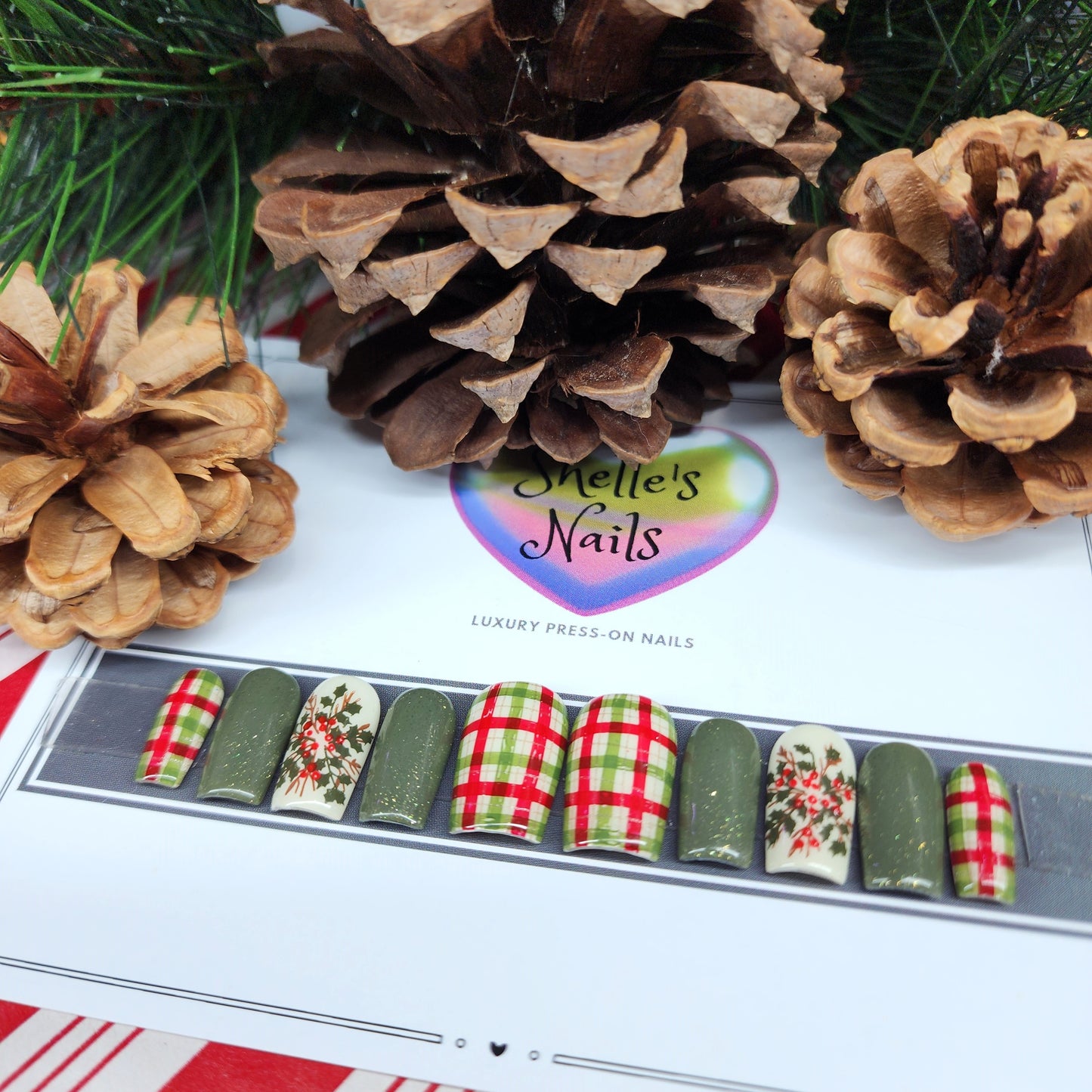 Get holiday-ready with this festive set of reusable gel press-on nails! Featuring green nails with gold shimmer, classic red, green, and gold plaid, and charming red holly accents, this nail set combines elegance with holiday cheer. Easy to apply, durable, and reusable, these press-ons are perfect for creating a salon-quality look at home. Ideal for Christmas parties, seasonal events, or cozy celebrations, this chic nail set adds a touch of festive flair to any outfit.