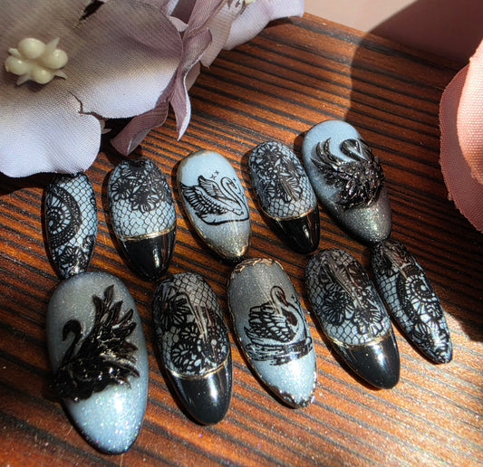 Black Swan luxury press-on nails inspired by BTS. Handmade gel nails in elegant black with custom sizing for a salon-quality fit. Reusable, durable, and perfect for statement nail looks.