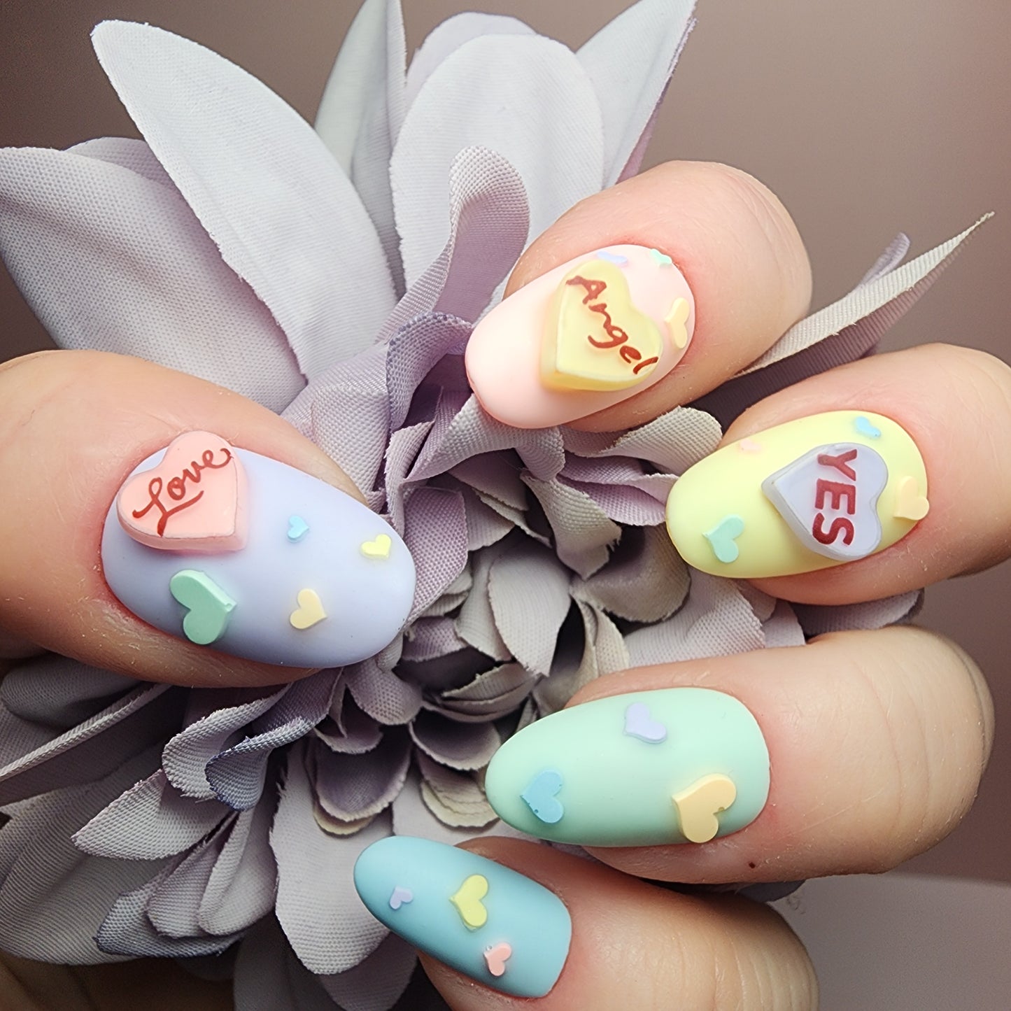 Pastel conversation heart 3D press-on nails with candy heart sayings