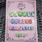 Ready to Wear set of nails in short squoval, pastel in color with black flecks resembling eggs found in nature. 