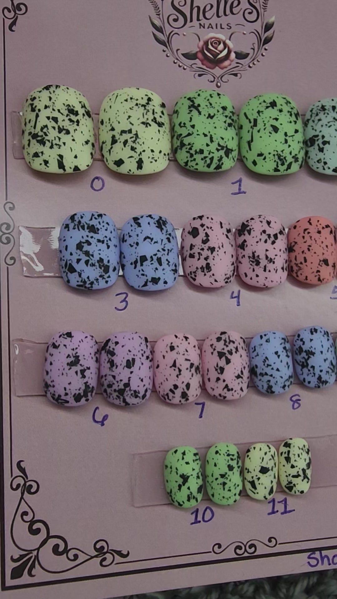Ready to Wear set of nails in short squoval, pastel in color with black flecks resembling eggs found in nature. 